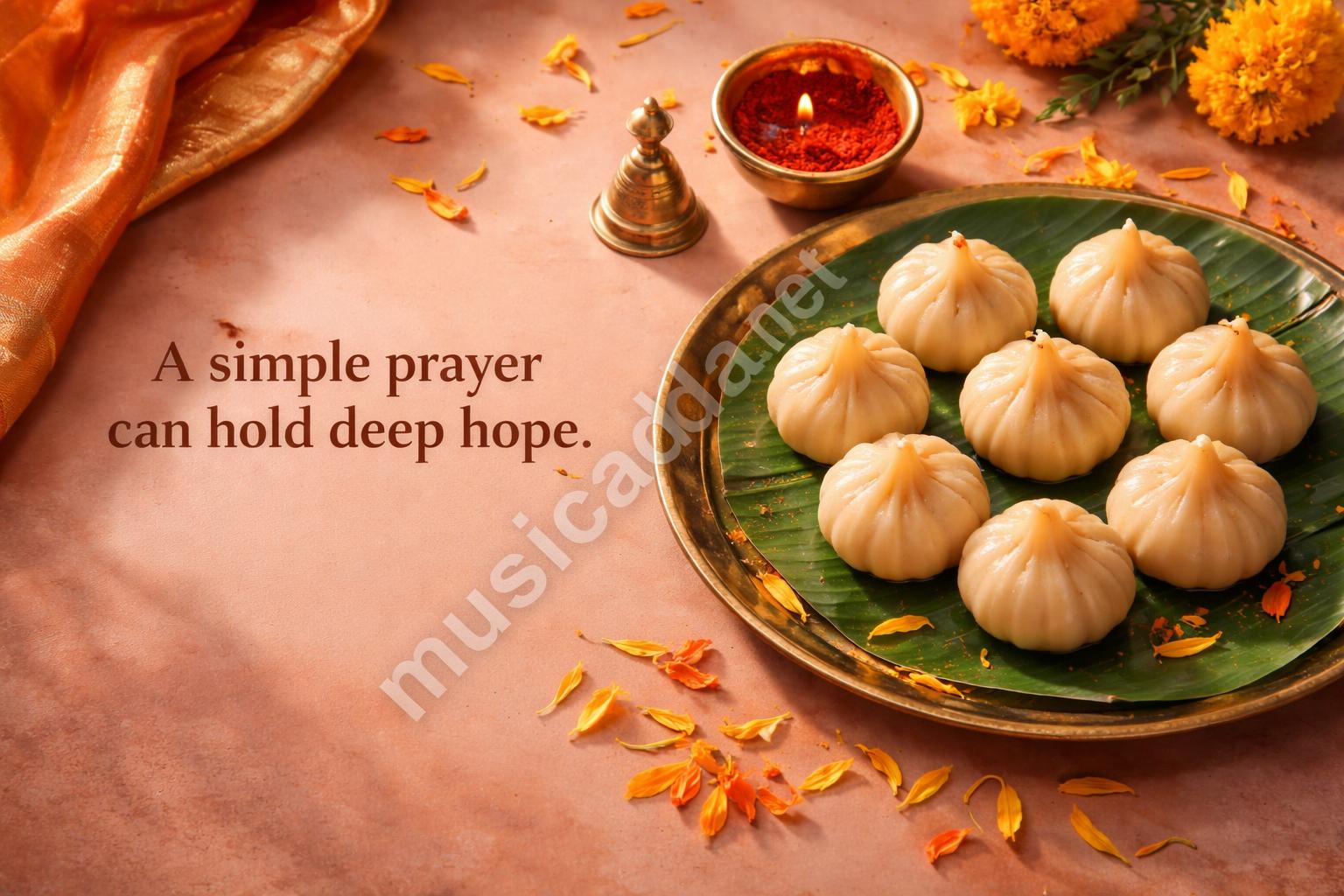Ganesh chaturthi candle and modak flat lay