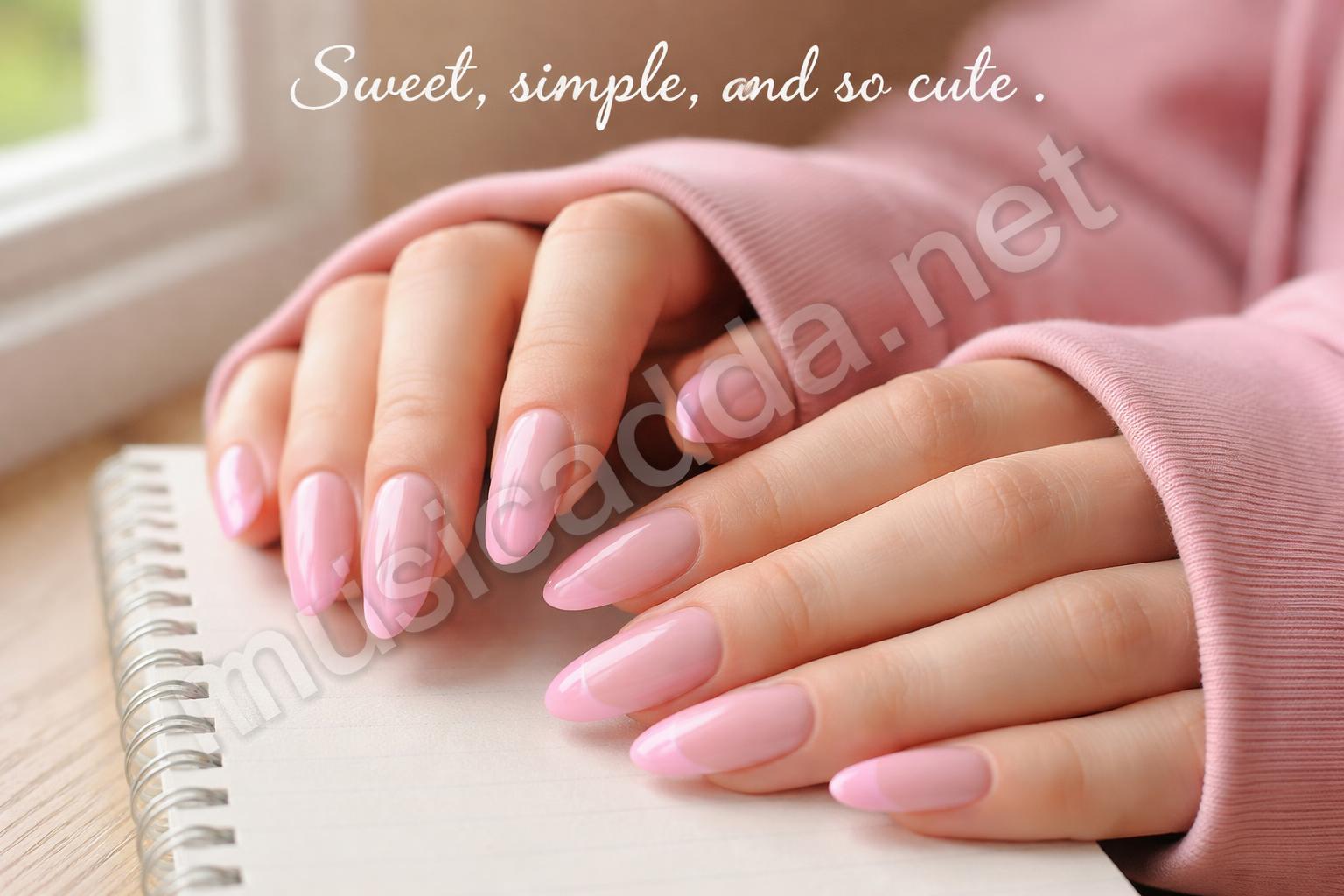 Pink french tip acrylic nails closeup
