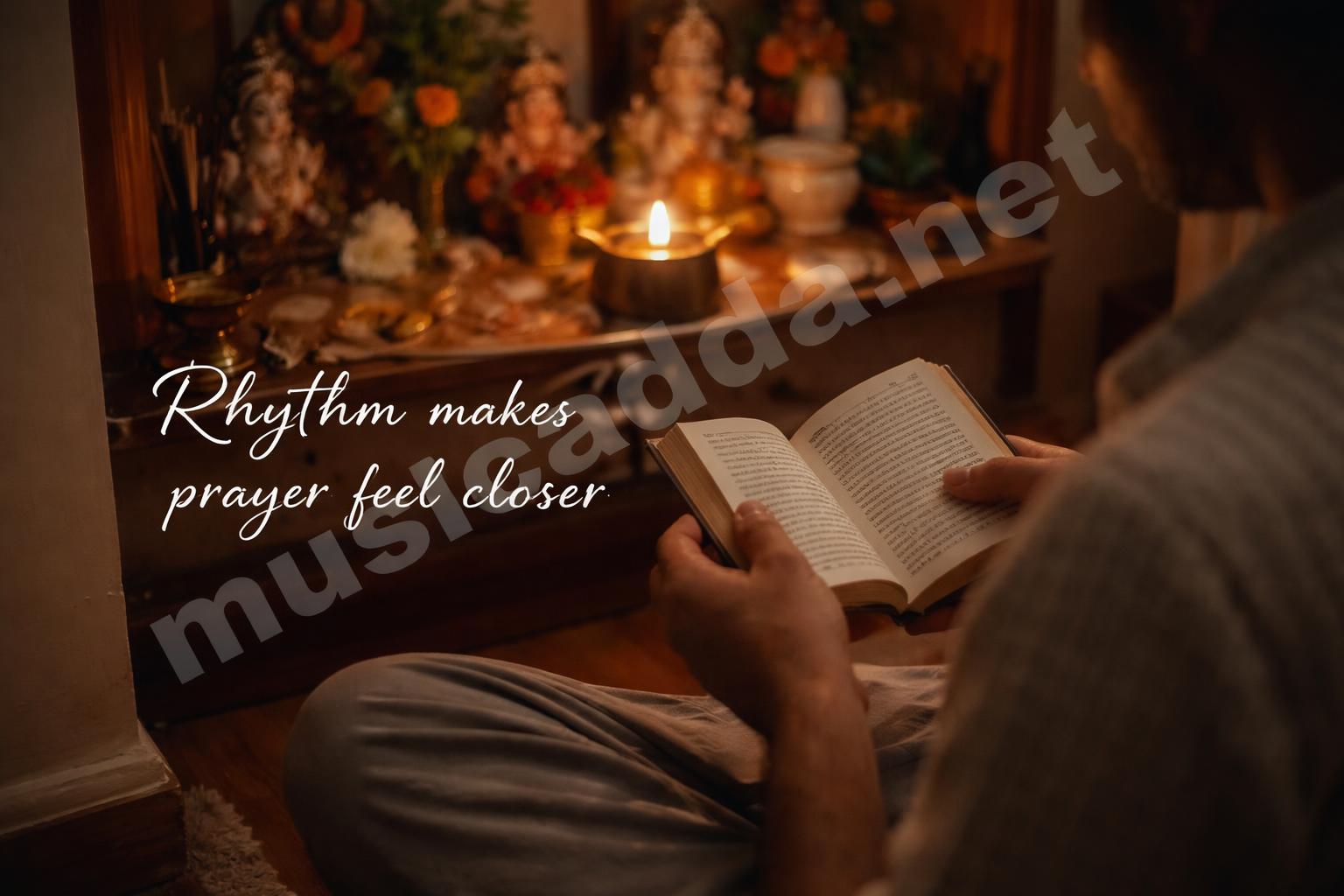 Devotee reading ganesh aarti book near diya