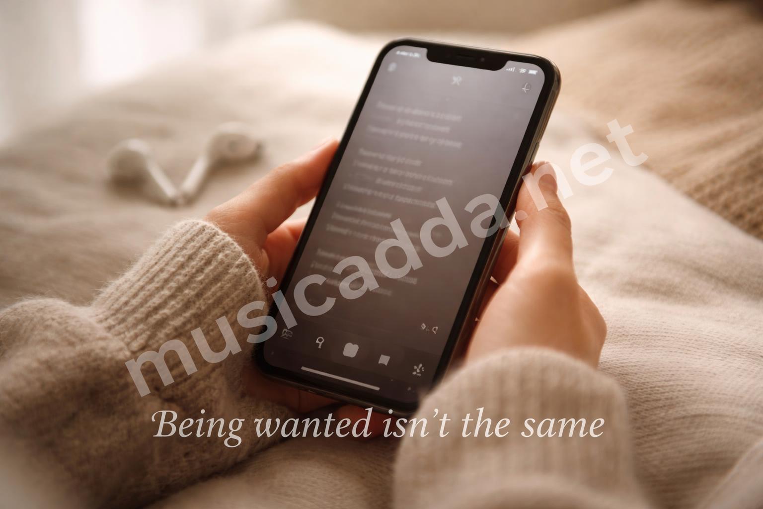 Hands holding phone with lyrics on screen