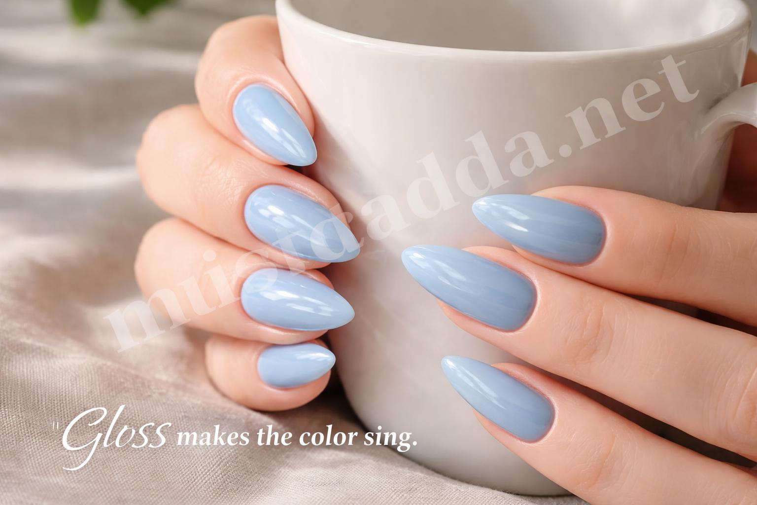 Glossy baby blue almond nails closeup