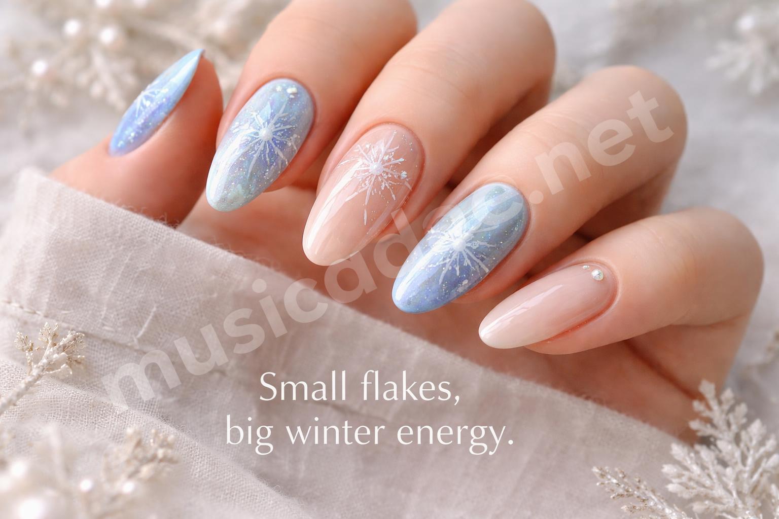 Icy blue snowflake nail art close up