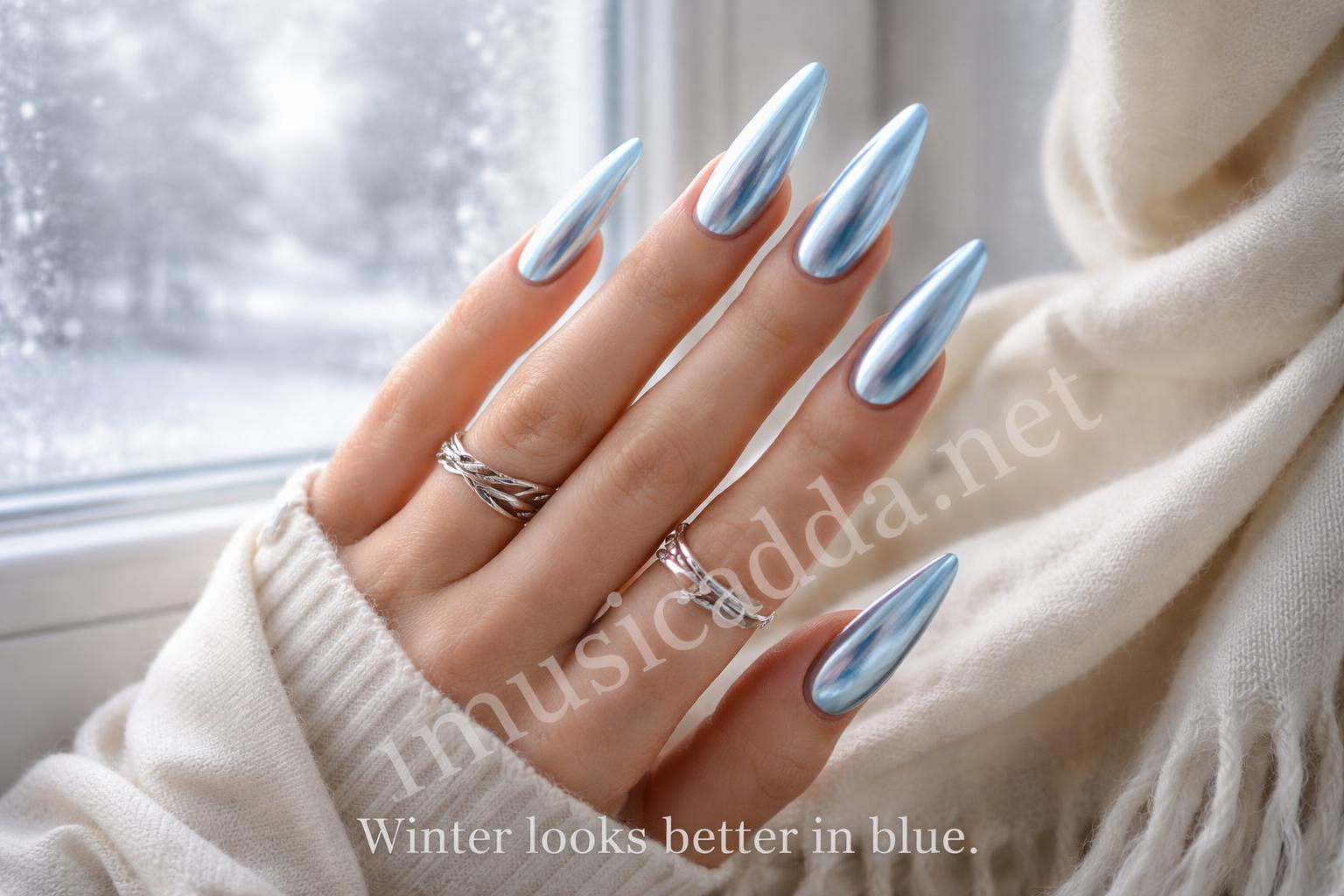 Long icy blue almond chrome nails